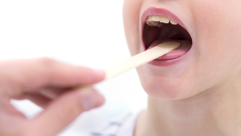 Person getting throat checked