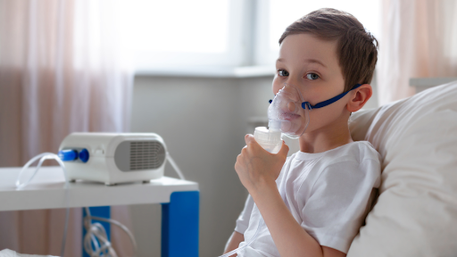 Child using nebulizer for treatment