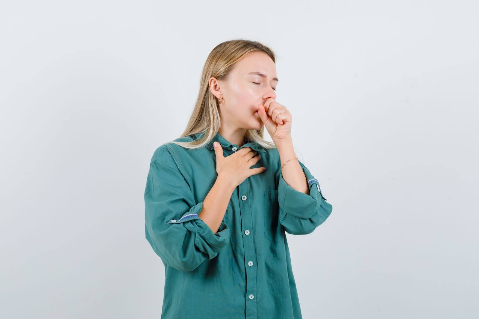 Woman Coughing Due to Tonsils Discomfort