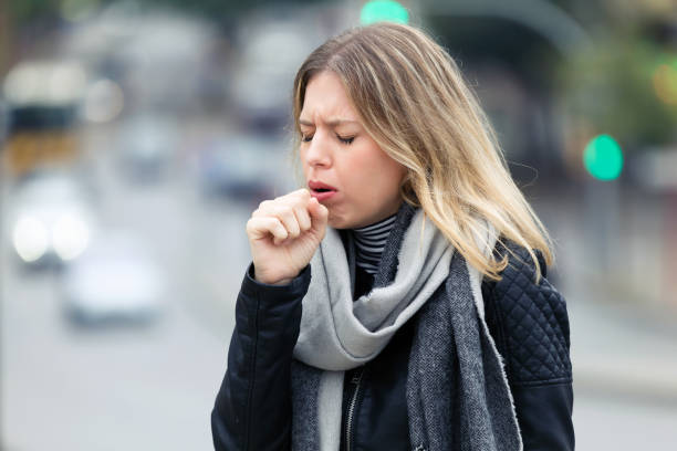 a woman coughing