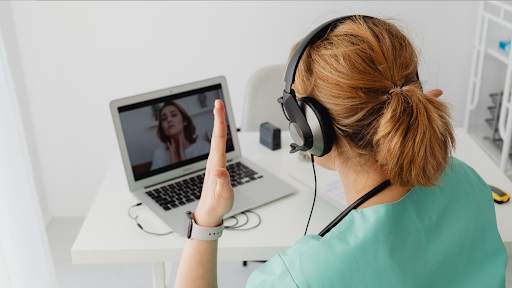Doctor communicating with patient on a video call