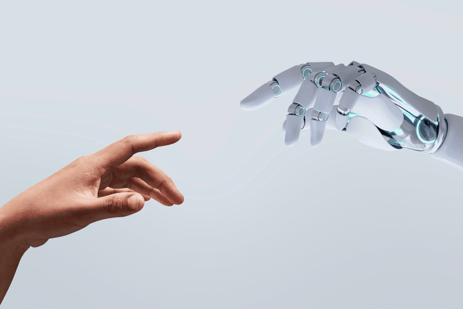 Human and robot hand reaching towards each other.