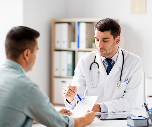 Male patient speaking with primary care doctor.