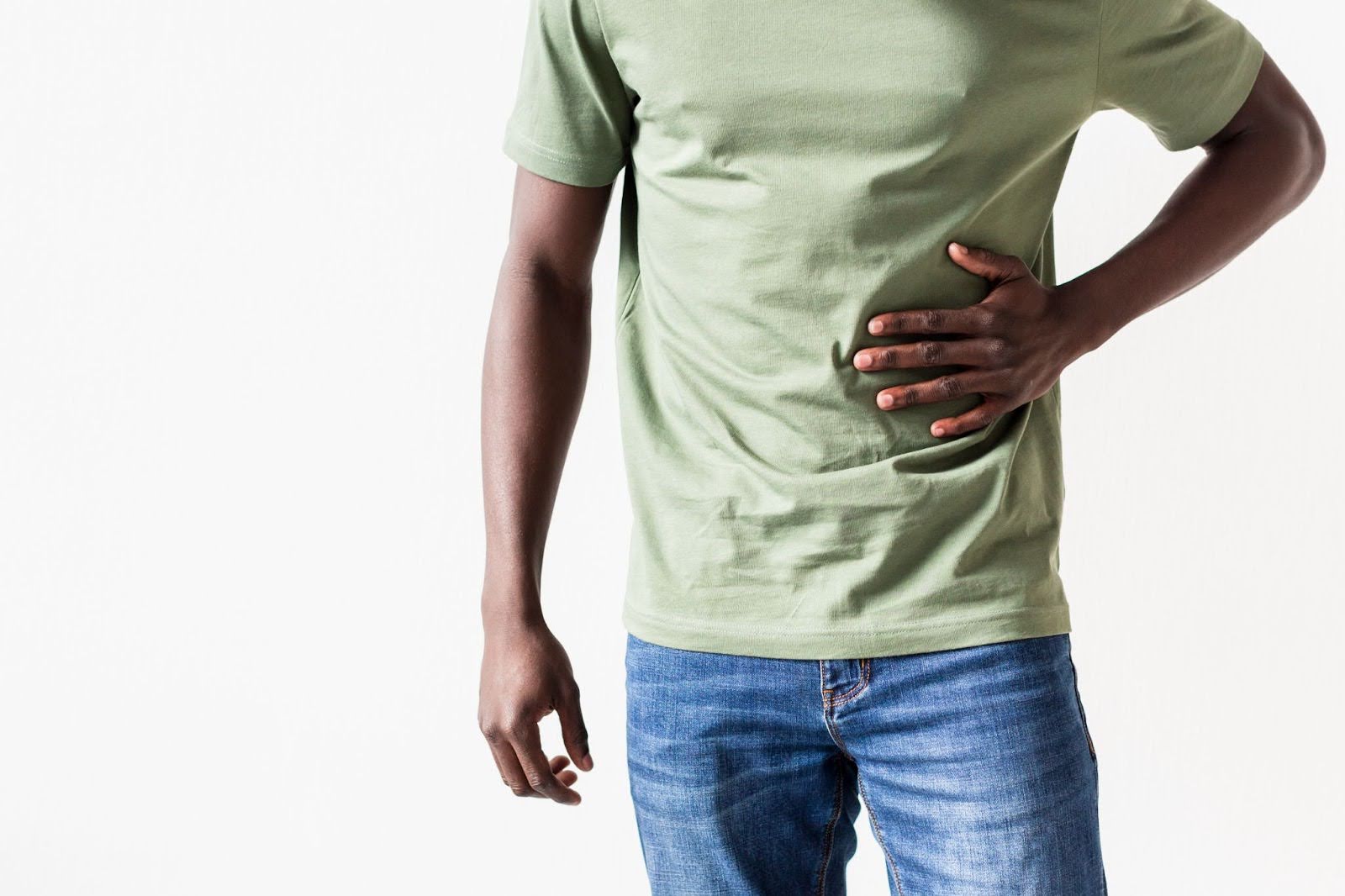 Man holding his abdomen due to pain