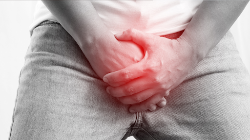 Man holding his crotch area in pain