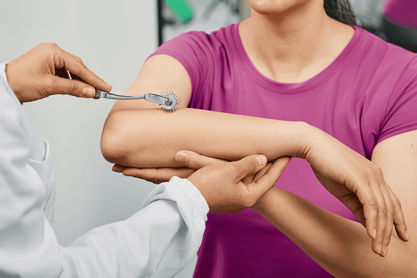 Neurological exam using a pinwheel tool on a patient’s arm.