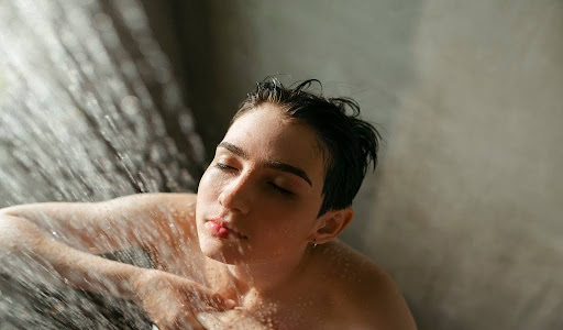 Refreshing moment - a woman taking a peaceful shower