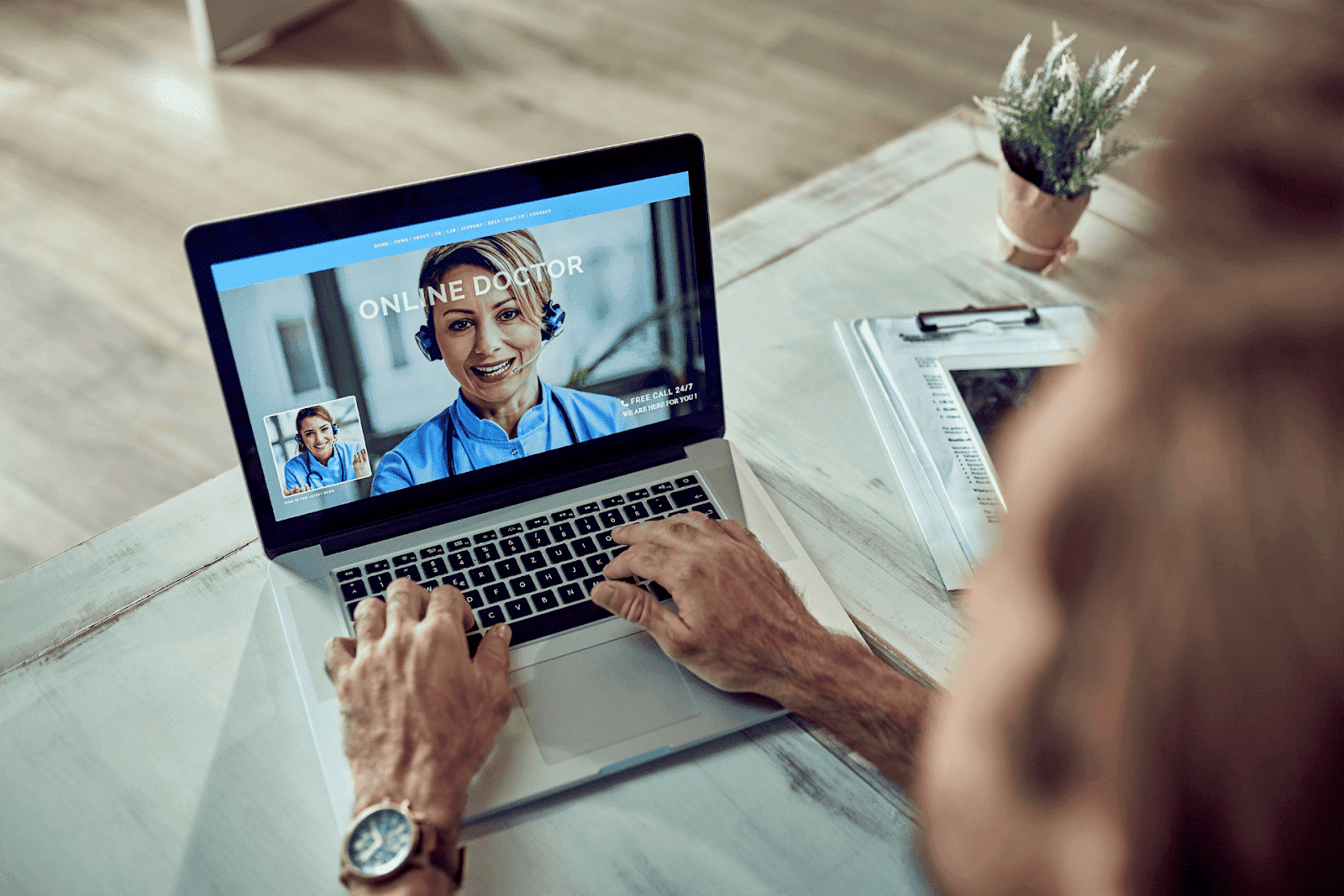 Person video chatting with an online doctor on a laptop