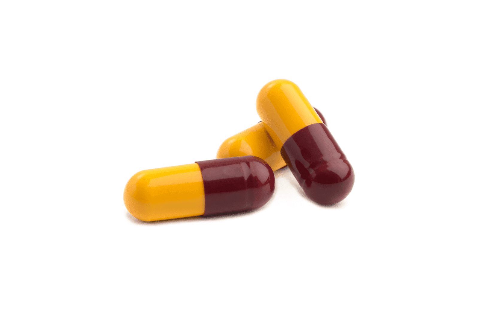 Two red-and-yellow capsules on a white background.