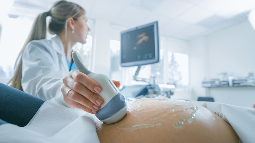 Ultrasound being done on a woman's belly