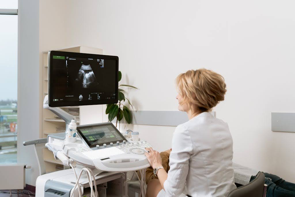 Woman looking at an ultrasound image.