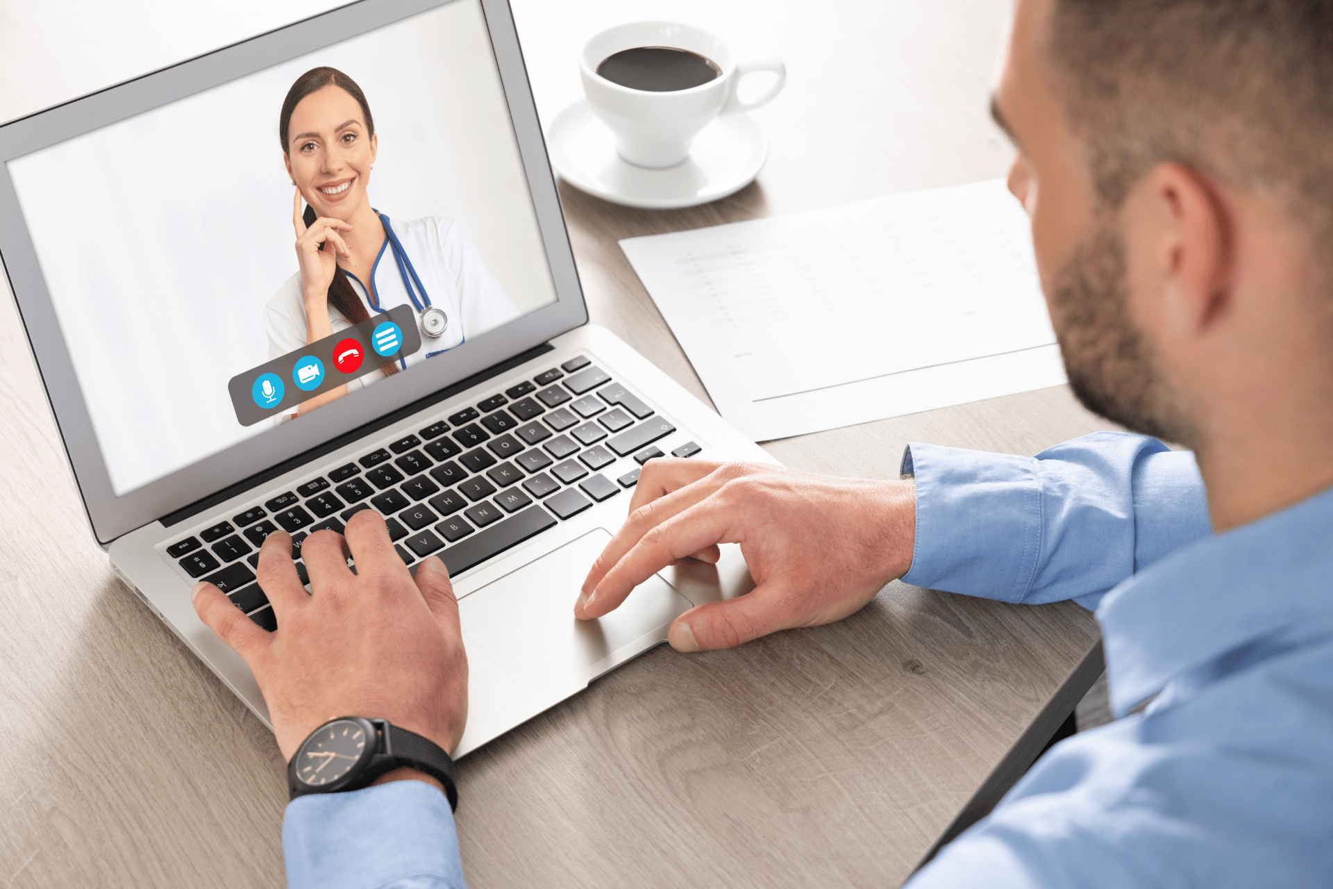 Man having an online video call with a smiling female doctor.