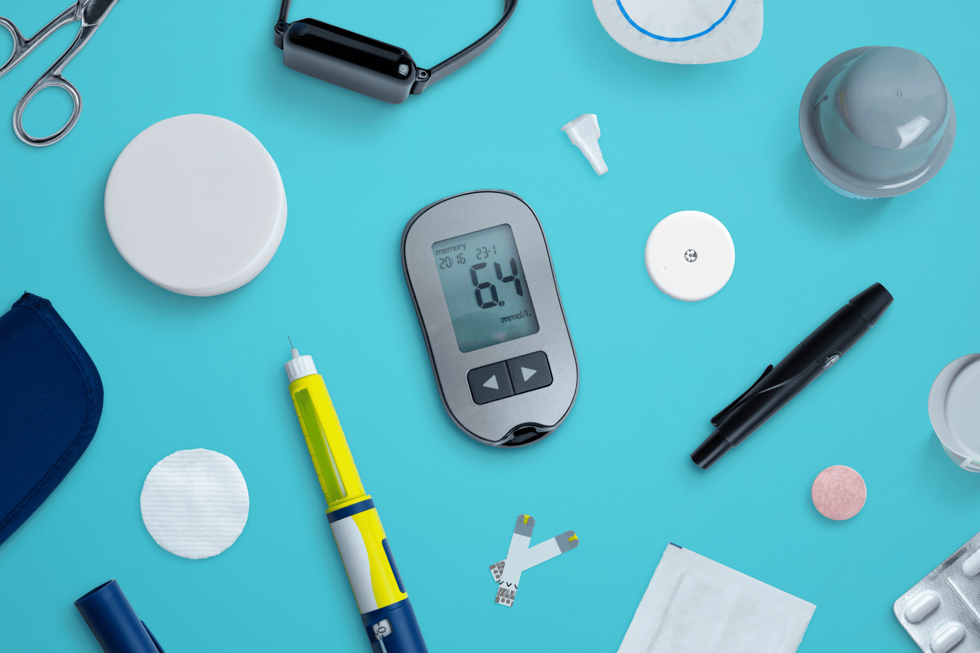 Blood glucose meter reading 6.4 mmol/L surrounded by diabetes supplies, including a lancet device, test strips, wipes, and medication items on a turquoise background.