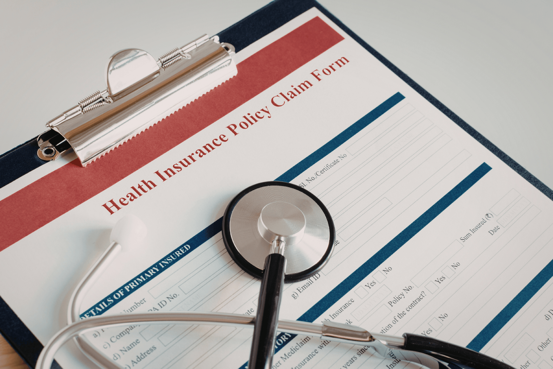 Health insurance policy claim form with stethoscope, representing medical coverage and claims processing.