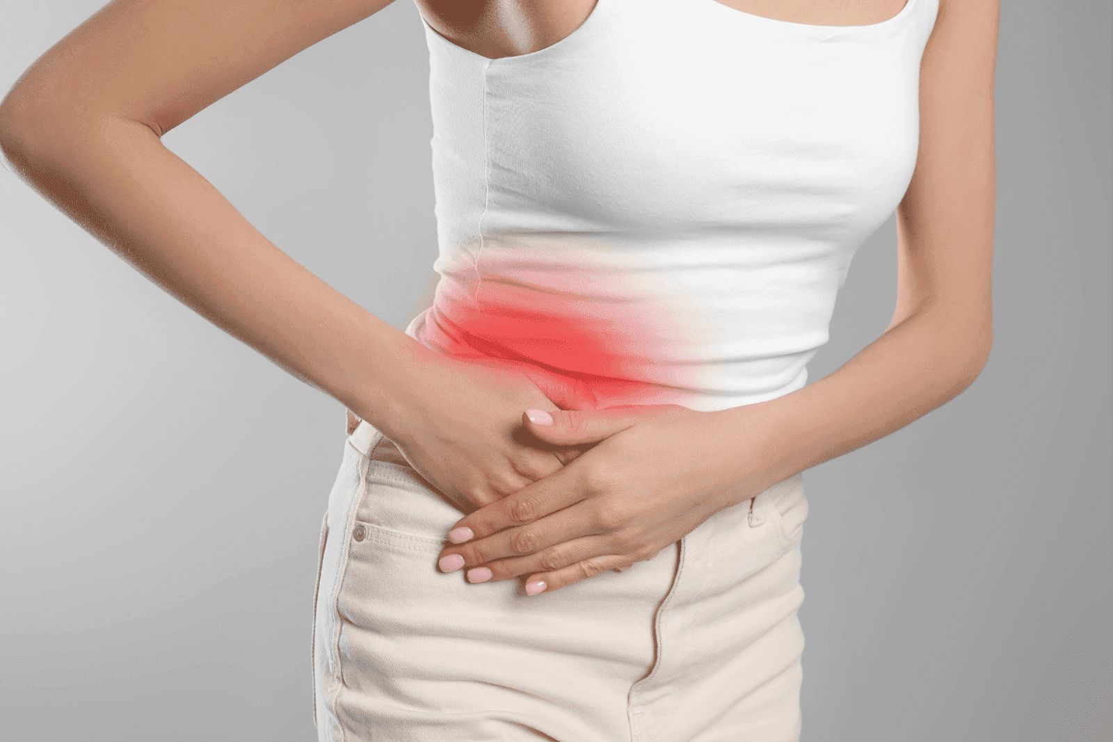 Woman clutching her lower abdomen in pain with a red highlight indicating discomfort