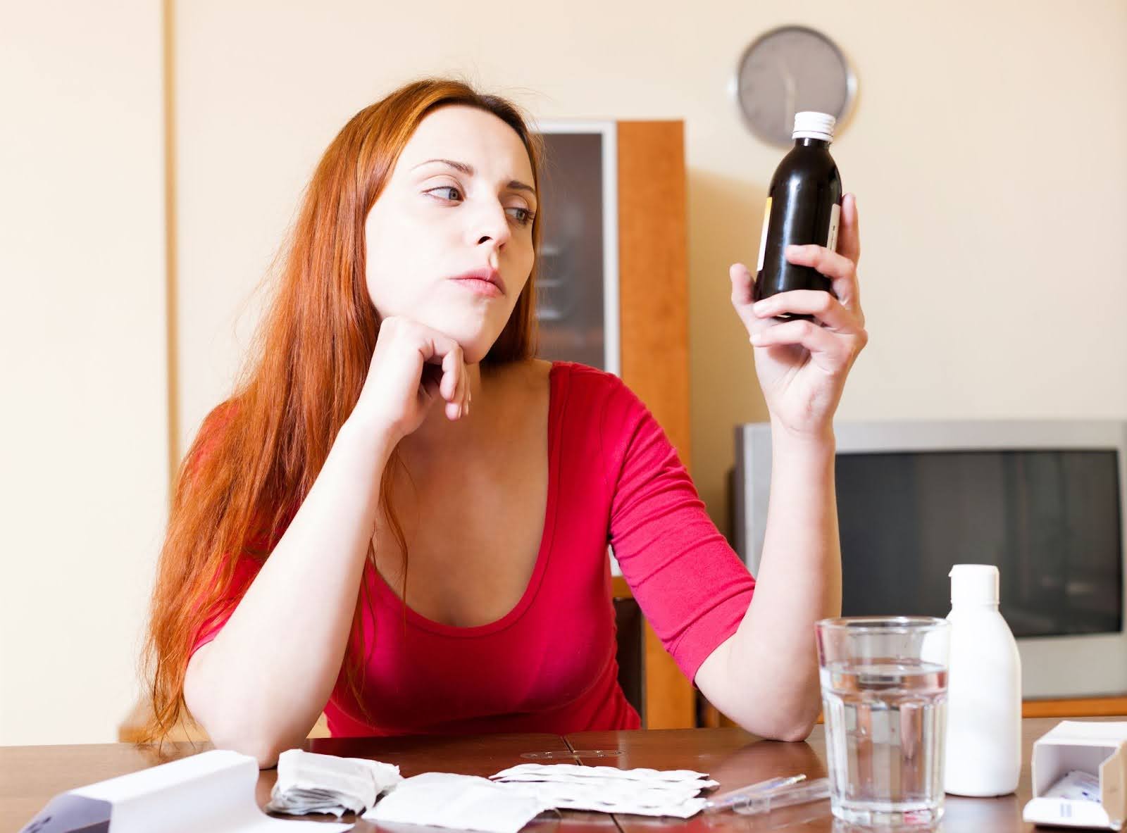 Woman reading medicine