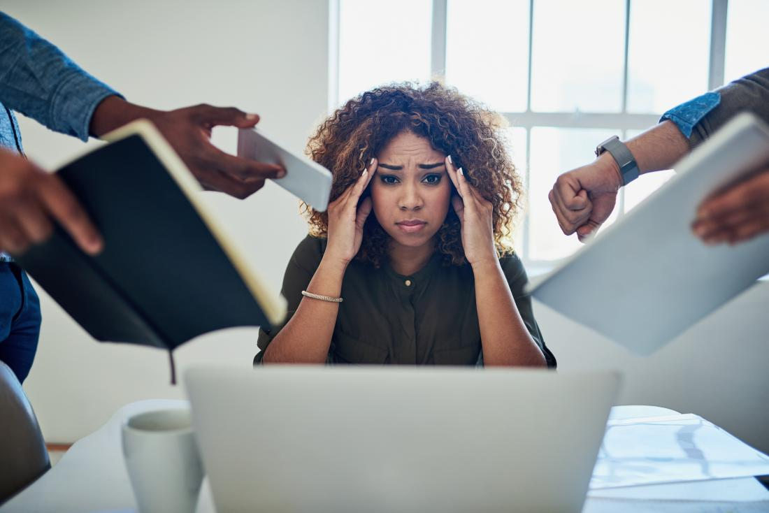 a woman under stress due to increased workload and pressure