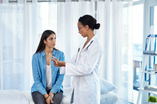 A woman consulting with a female doctor